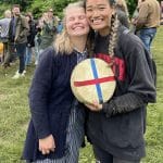 Abby Lampe and friend celebrate after her victory in the cheese race.