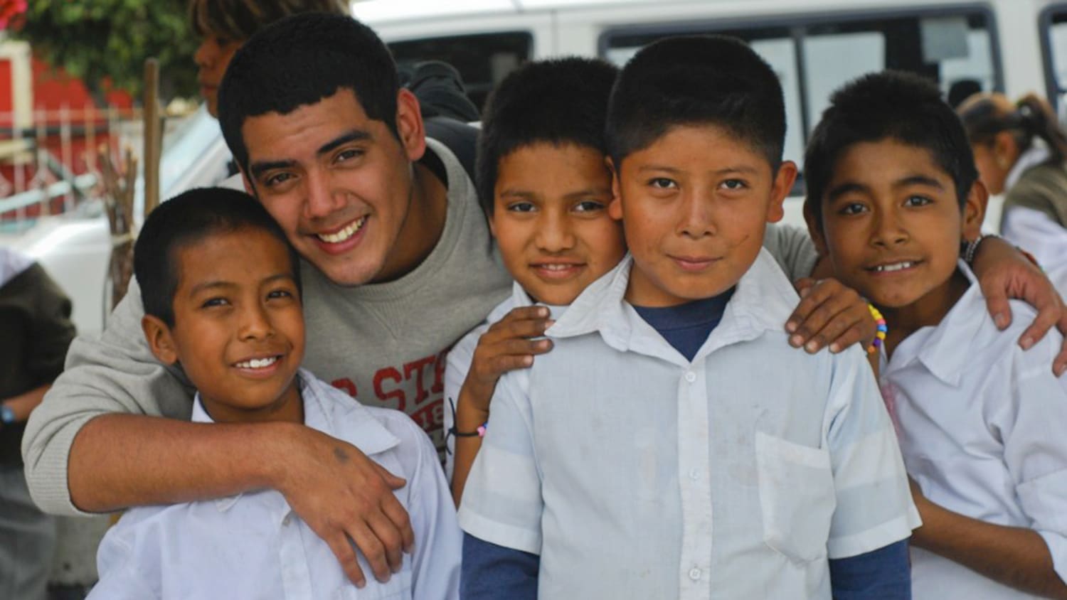Saul Flores with some of the children he met on a service trip to Atencingo, Mexico.