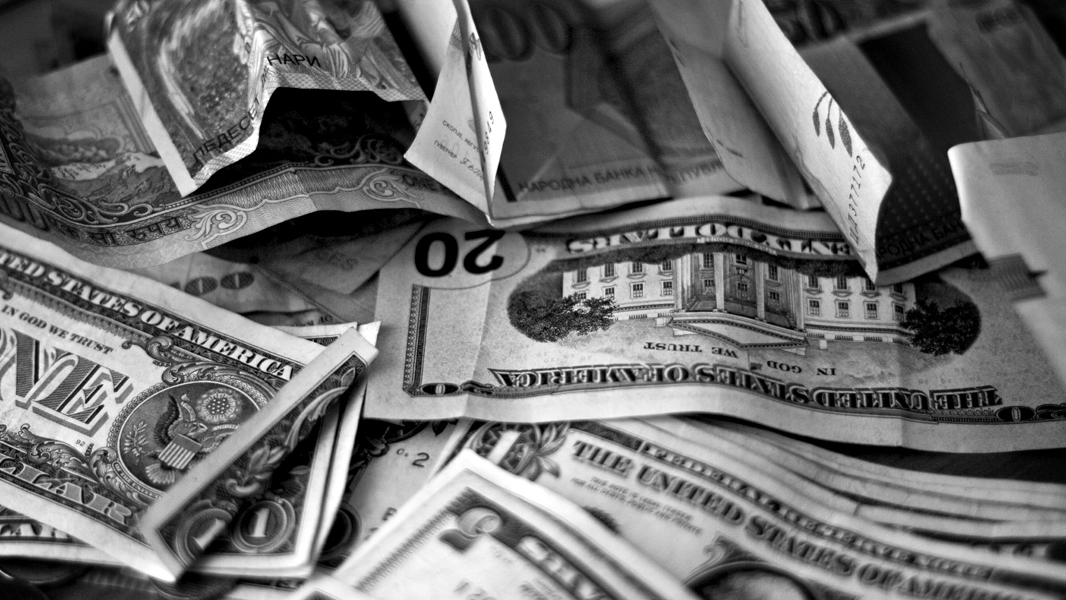 Various cash bills in black and white