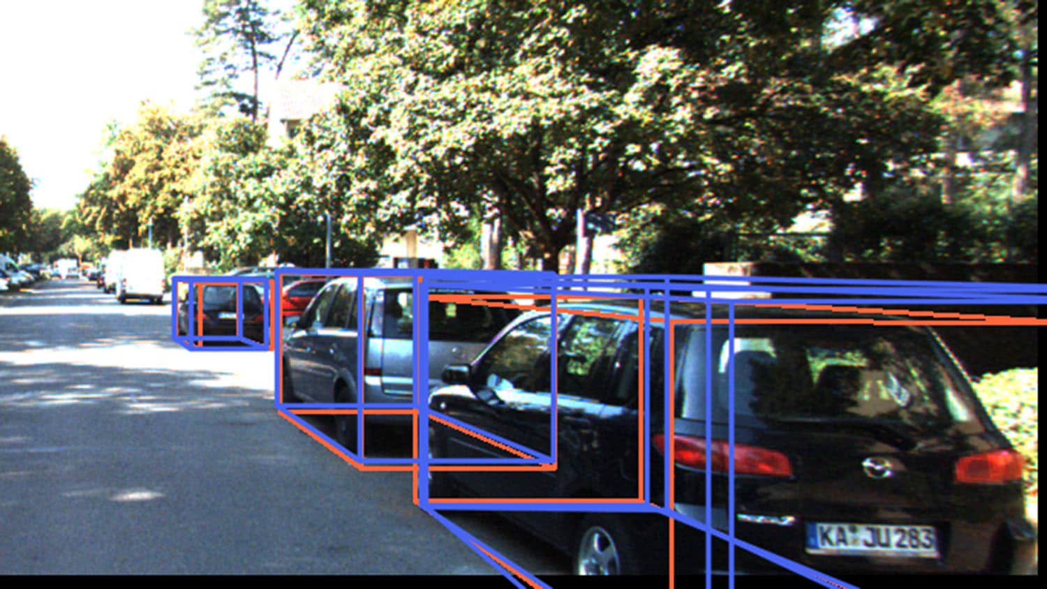 图片显示了街道上的汽车，每辆车都被线包围，表示一个边界框