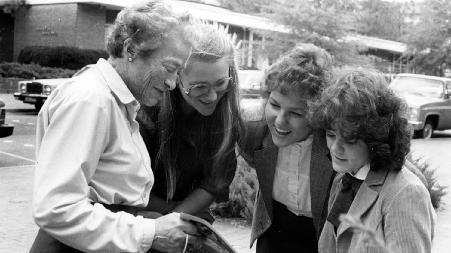 Katharine Stinson with three students