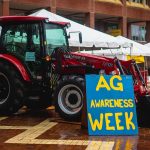 A tractor sits in the Brickyard near a sign reading 