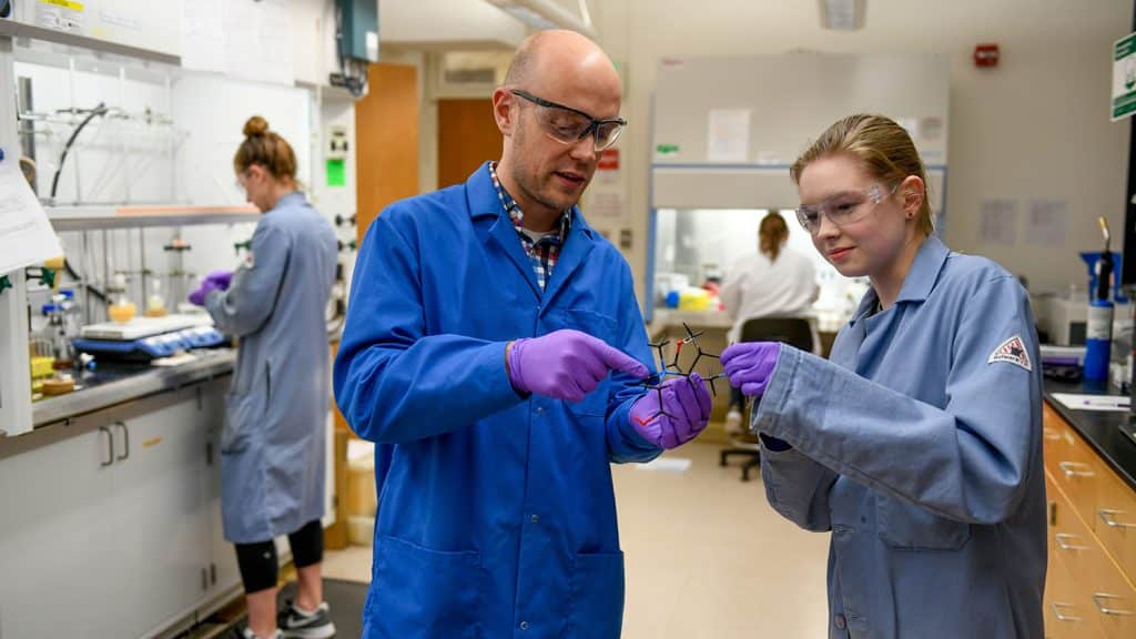A faculty member and a student work together in a chemistry lab on main campus.