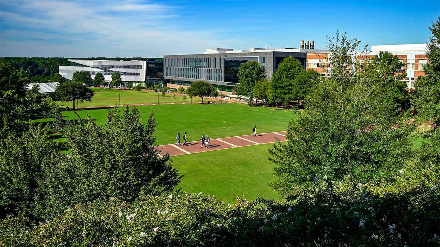 Students walk on the main path through Centennial Campus