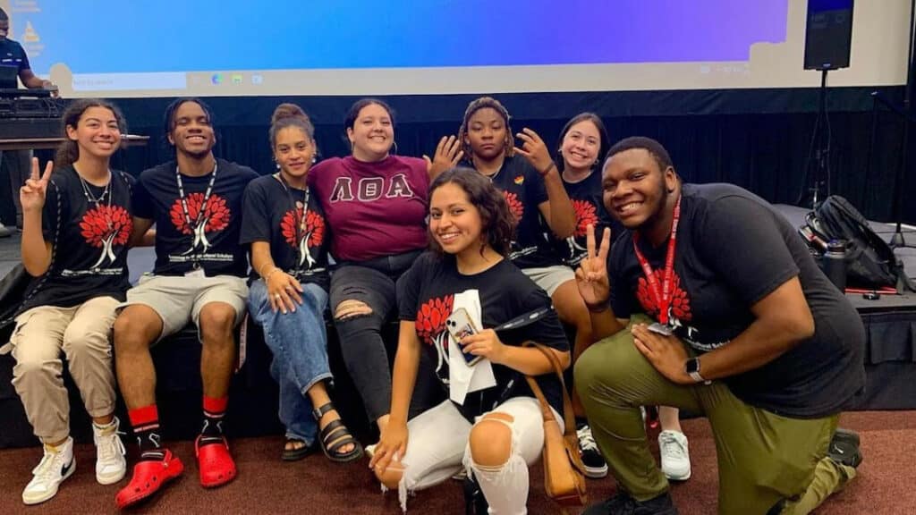 Student mentors smile at the camera during the 2022 Symposium for Multicultural Scholars.