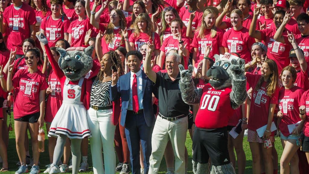 Students pose with the Chancellor and Mr. and Ms. Wuf for a group photo.