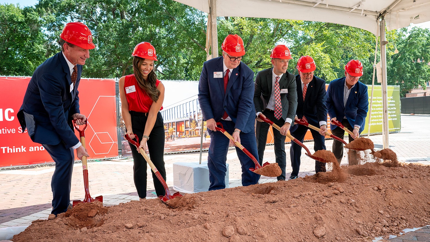 A group of NC State leaders in hard hats 