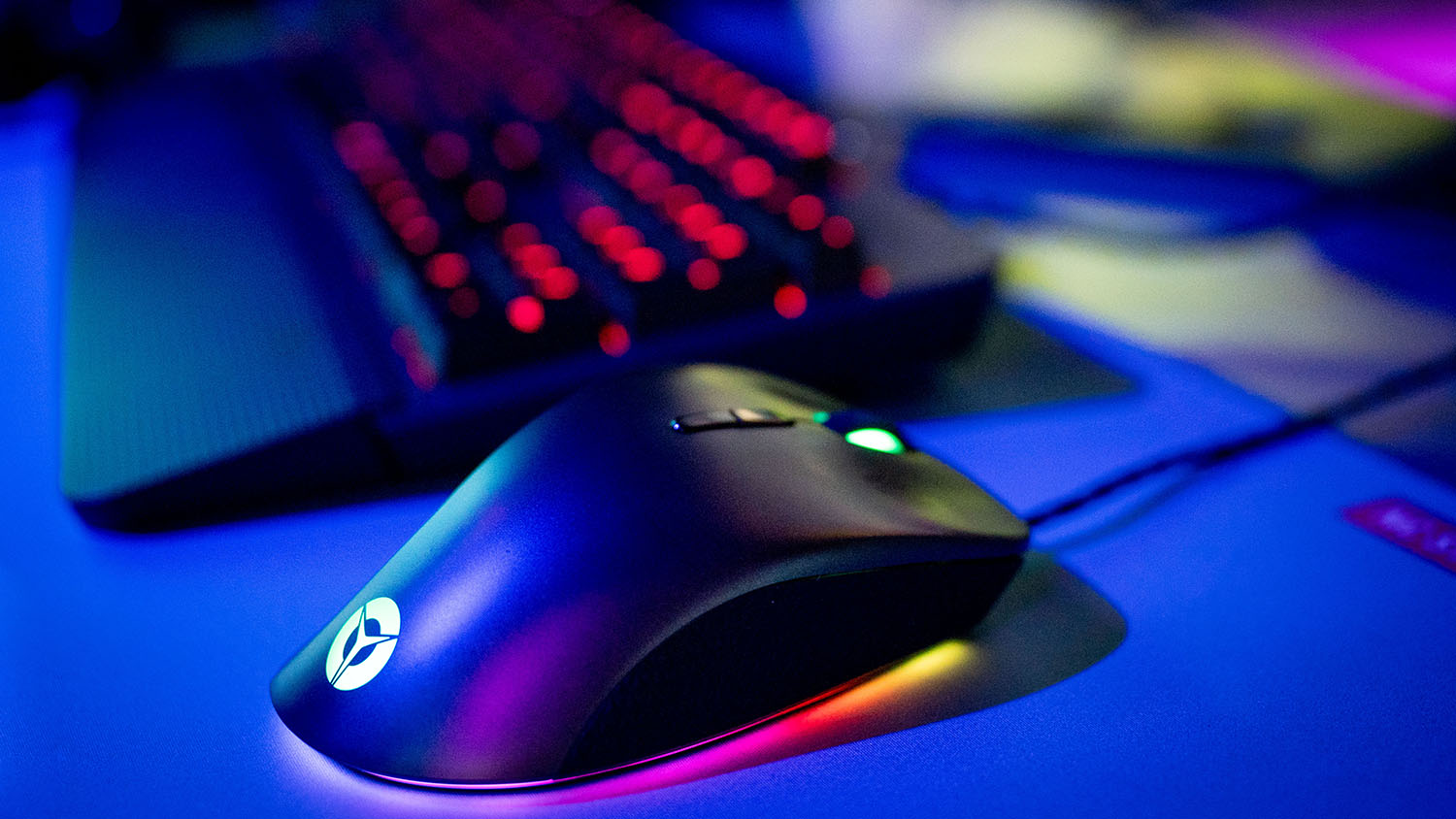 A closeup of a mouse and keyboard under dynamic lighting in Hunt Library's Teaching and Visualization Lab.