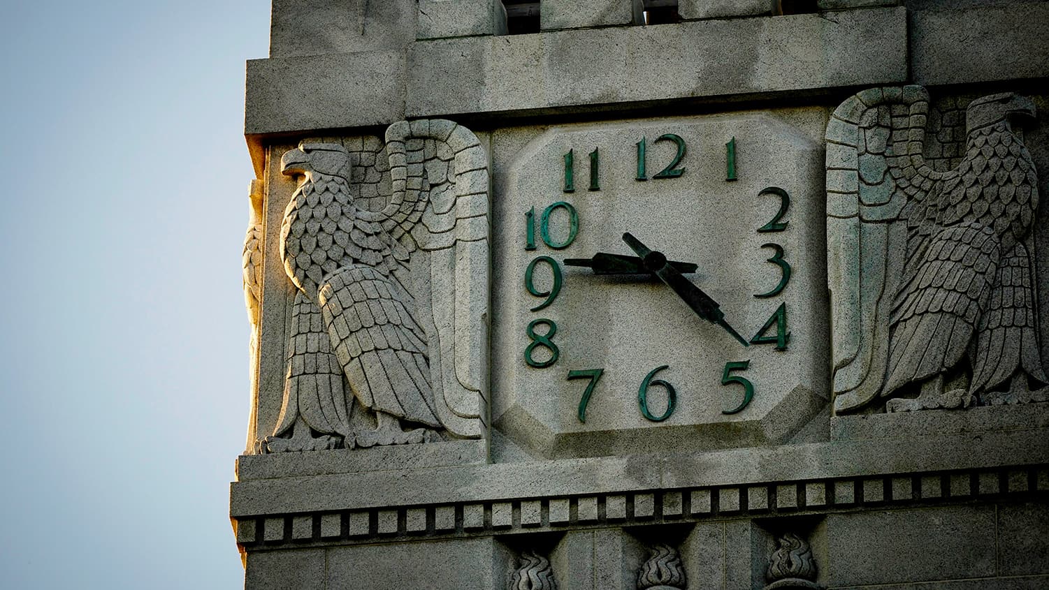 Close-up view of the clock at the top of the Memorial Belltower